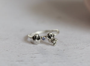 Double skull sterling silver ring with tanzanite