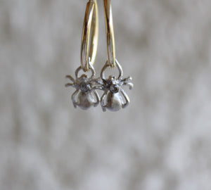 Spider hoop earrings with white topaz