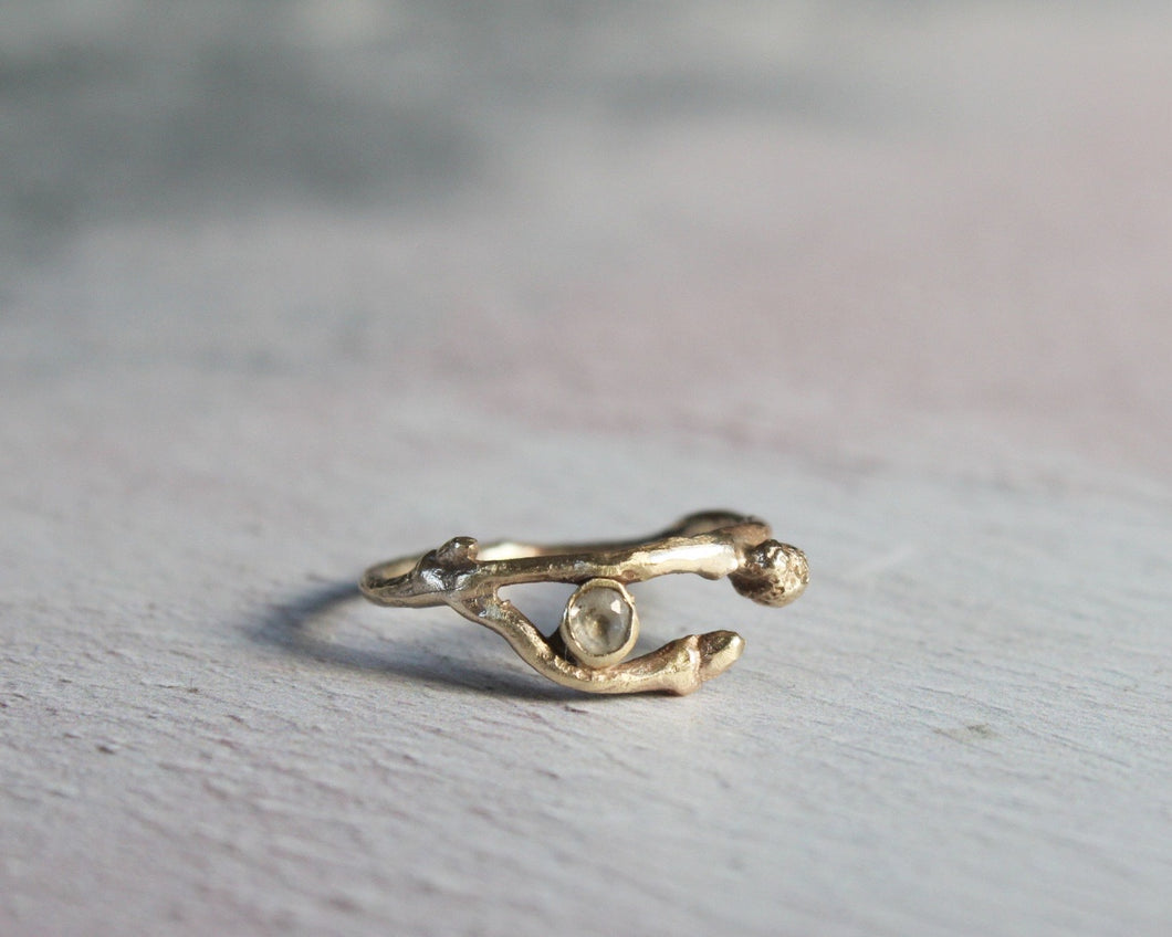 9k solid gold twig ring with white topaz