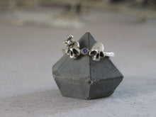 Load image into Gallery viewer, Double skull sterling silver ring with tanzanite
