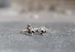 Double skull sterling silver ring with tanzanite